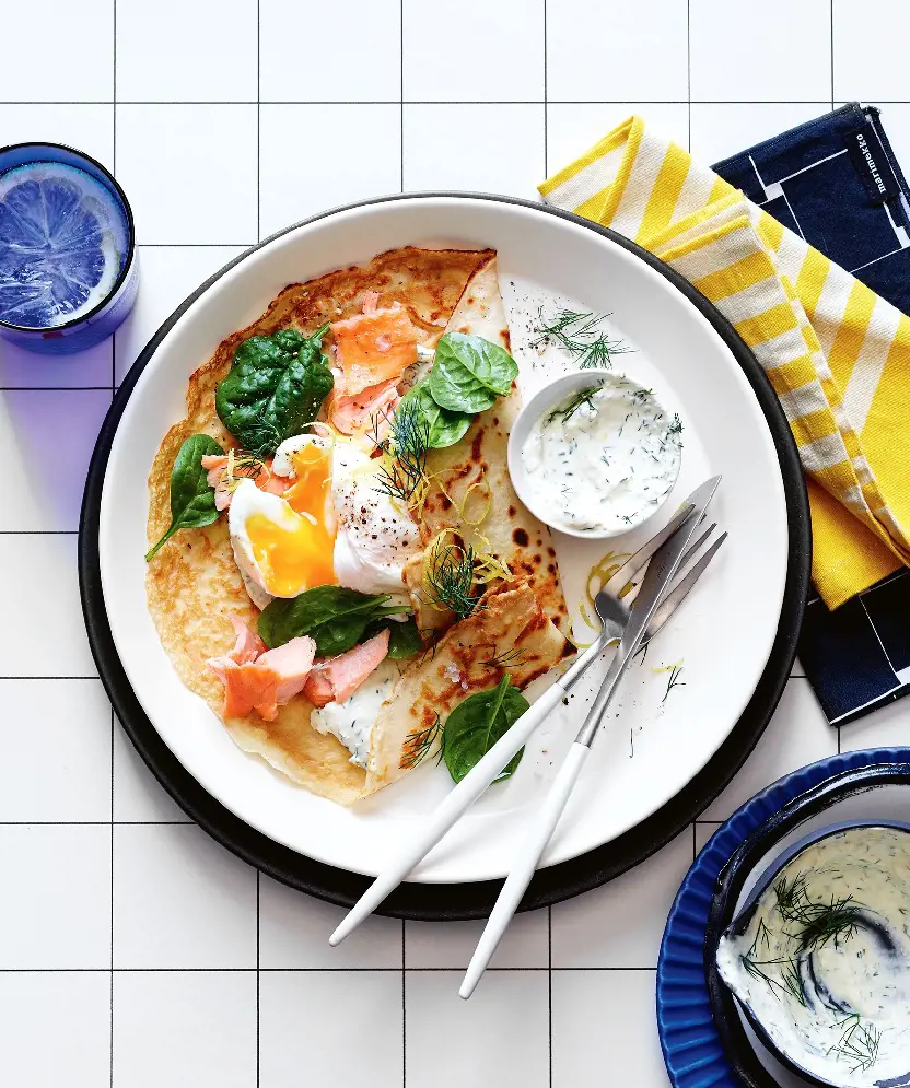 Poached eggs and smoked salmon crepes is a must-try for your next sunday morning pancake alternative.