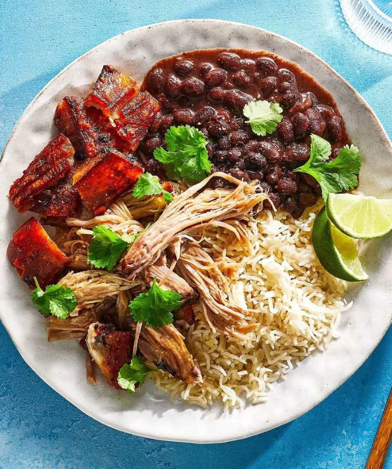 A selection of beloved Puerto Rican dishes comprises mofongo, tostones, pasteles, arroz con gandules, tembleque, and coquito, among others