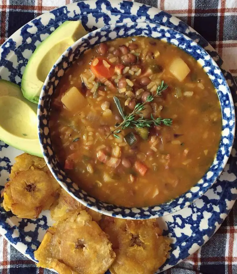 This simple vegetarian stew makes a hearty and inexpensive main course, featuring fresh pigeon peas (gandules verdes)
