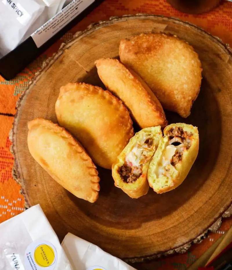 Delicious coconut curry chicken and cheese empanadas with basmati rice