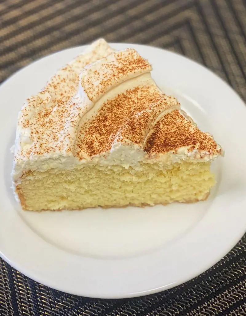 Tres leches cake soaked in three types of milk and topped with fluffy whipped cream